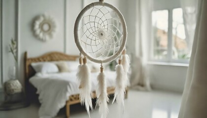 White handmade dreamcatcher in bedroom. Interior decoration