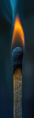 Close up of a matchstick about to ignite leading the way to light set against a dark minimalist background