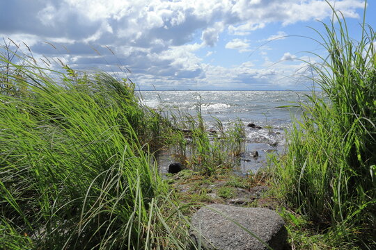 Hindens rev at V&auml;nern. The biggest lake in Sweden. Large wet rocks. Windy outside this summer day. Near Lidk&ouml;ping.