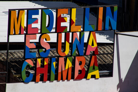 MEDELLIN, COLOMBIA - JANUARY 17, 2024:  Colourful terrace with the sign Medellin es Una Chimba which means something like Medellin its great, at the famous Comuna 13