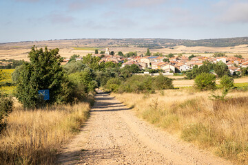 French Way of Saint James - a gravel road with a view to Ages (Arlanzon), comarca of Montes de Oca, province of Burgos, Castile and Leon, Spain