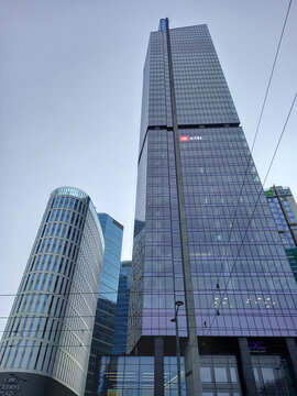 Warszawa, Poland - 11 February 2024: The Skyliner and The Warsaw Hub skyscrapers in Warsaw. XTB Logo sign.