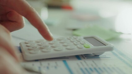 When analyzing risks associated with business projects, a modern business analyst uses an innovative calculator to calculate digital indicators. A professional's fingers move easily across the keys