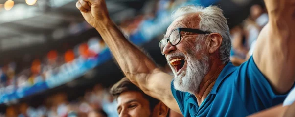 Fotobehang A delighted mature man and his elderly dad cheering on their favorite team together at the stadium during a sports event. © ANStudio