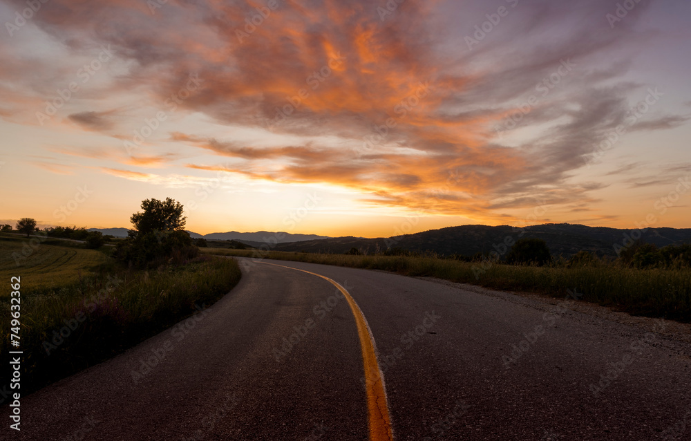 Wall mural sunset over the road