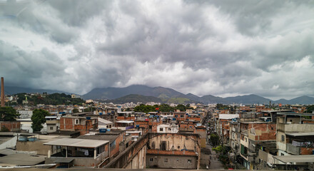 Fototapeta na wymiar A favela in Rio de Janerio on a cloudy day as seen from a highway