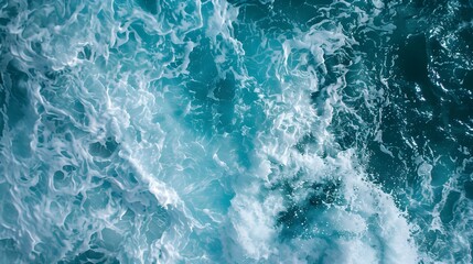 Fototapeta premium aerial view of turquoise ocean water with splashes and foam for abstract natural background and texture