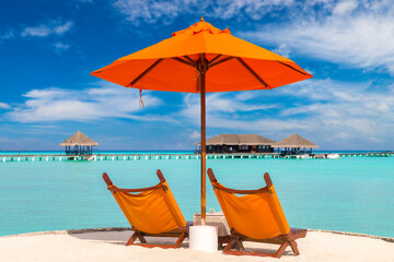 Sun bed and parasol at tropical beach