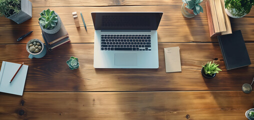 Workspace with Laptop on Wooden Table Surrounded by Office Supplies - 749651508