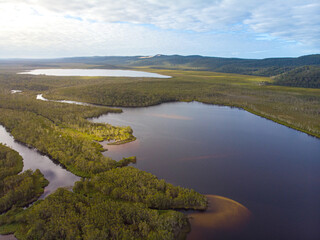 aerial panorama of unique ecosystem of noosa everglades - beautiful curvy noosa river and lush, green wetlands in south east queensland, australia, near sunshine coast and noosa heads