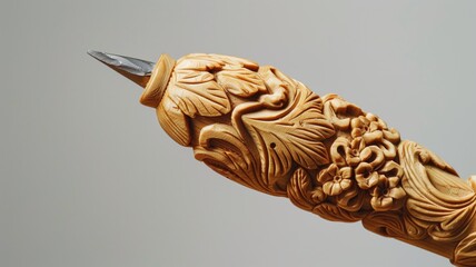 Exquisitely carved wooden fountain pen on a plain backdrop