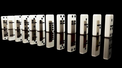 Line of dominos rotating on table 1