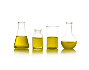 Laboratory glassware with yellow liquid isolated on white