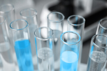 Test tubes with different samples, closeup. Laboratory glassware