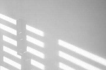 Light and shadows falling on white wall