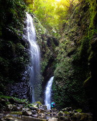 brave hiker girl admiring hidden gem of lamington national park - thunder and lightning falls;...