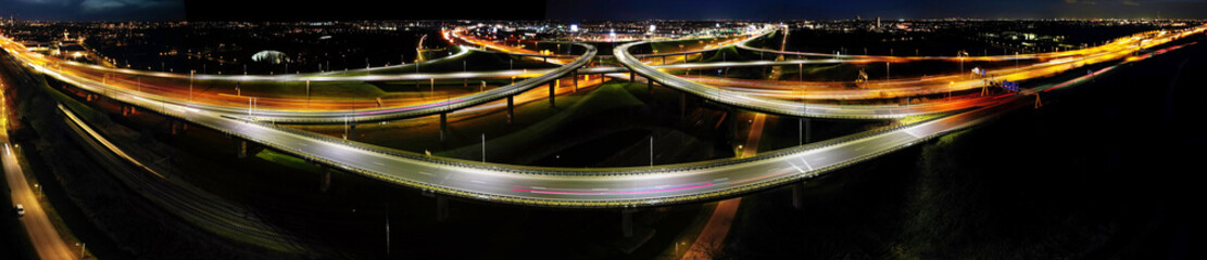 Aerial view at night of a cloverleaf interchange highway, The Haque, Holland