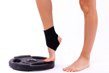 Sports female legs in an elastic medical bandage - 749681128