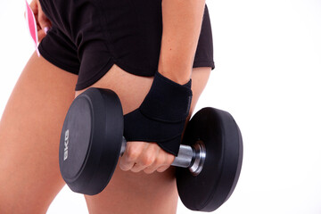 Dumbbell in a woman's hand close up - 749681141