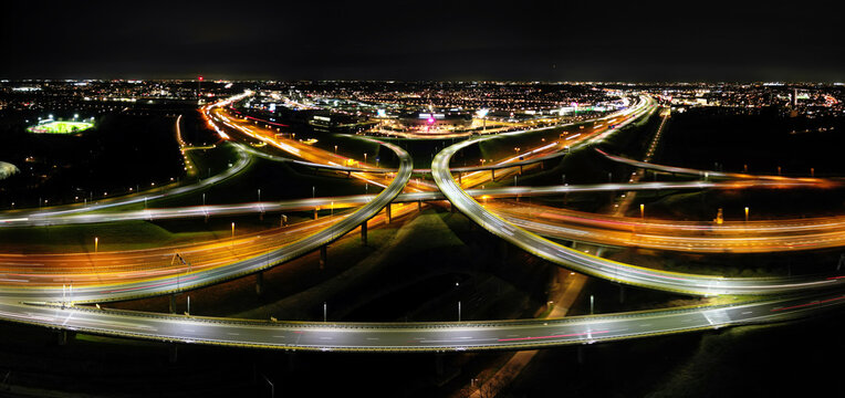 Aerial view at night of a cloverleaf interchange highway, The Haque, Holland