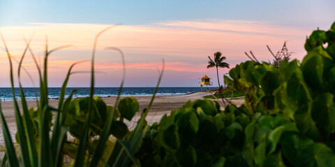 colorful sunset over the beach in coolangatta near point danger, gold coast, queensland, australia;...