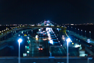 Fototapeta na wymiar A night miniature traffic jam on the highway at Tokyo bay area