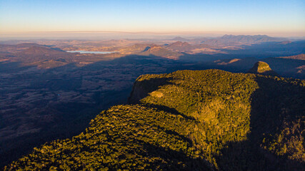 aerial panorama of mountains in main range national park at sunset; view from the area near bare...