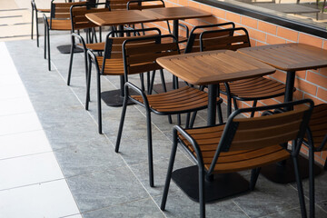 Wooden chair and table with brown steel structure in restaurant or coffee like