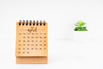 April 2024 Monthly desk calendar for 2024 year with plant pot.