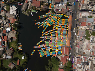 Colorful boats in Xochimilco, tours on canoes with floating gardens in CDMX, Mexico