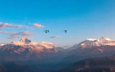 Papier Peint photo autocollant Annapurna flying ultralight aircraft over the Mount Annapurna range in Nepal.