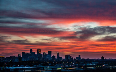 Fototapeta na wymiar Minneapolis Skyline at Sunset, Dusk, Minnesota, Peach Colored Sky, Clouds, Horizon, Cityscape