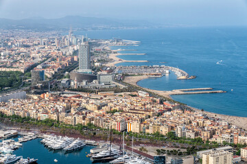 Barcelona aerial skyline panorama, beach with palms, city by the sea
