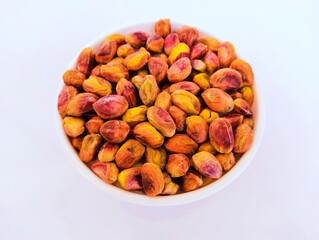 Pistachio nut kernels dry fruit food in a bowl pista  pistacho pistache, pistazie closeup view image stock photo
