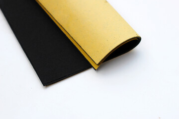 Black sandpaper on a white background.