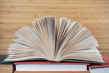 Open old book on natural background. Educational background library school concept.