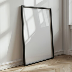 modern picture frame in black against wall, side view 