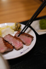 grilled beef tongue, japanese food，Sizzling premium grilled beef tongue served with pickles at Sendai station Japan 牛舌
