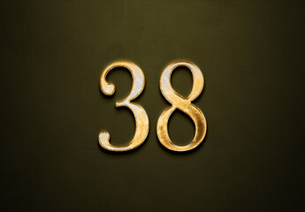 Old gold effect of 38 number with 3D glossy style Mockup.	