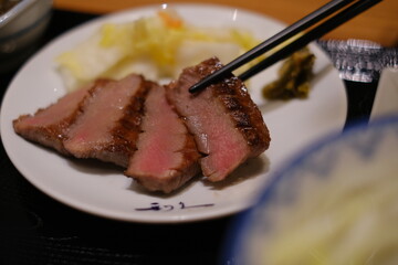 grilled beef tongue, japanese food，Sizzling premium grilled beef tongue served with pickles at Sendai station Japan 牛舌
