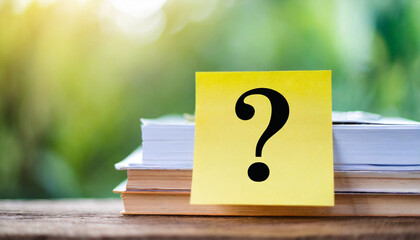 Panoramic stock photo featuring note paper with a question mark symbol on a clean background