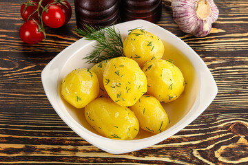 Boiled potato with oil and dill