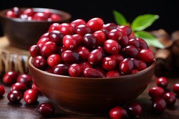 Organic ripe cranberries in a wooden bowl on rustic wooden background for thanksgiving recipes