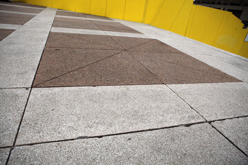 Fototapeta premium Yellow board protecting construction site in Place des arts - Montreal - Quebec - Canada