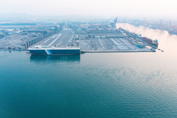 Aerial top view of ro-ro ship of business logistic sea freight, large industrial import-export...