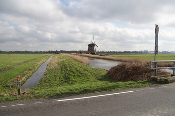 Ditch called Bergerringsloot. Old Dutch thatched windmill (circa 1591, rebuilt 1993) called...