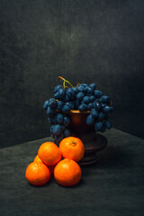 Still life with tangerines and grapes