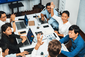Office worker raise hand up asking for question during business meeting on data analysis using BI...
