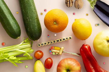 Supplements pills concept word with different fruits and vegetables on white background - 749789180