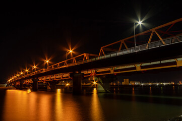 Fototapeta na wymiar 日立市の久慈川を渡る橋の夜景